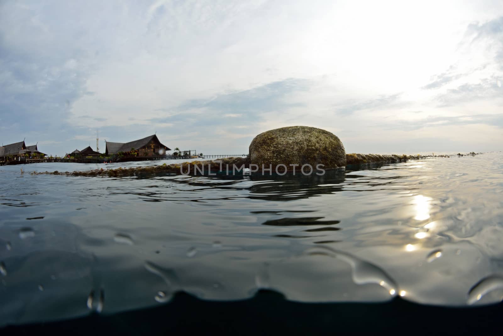 buoy floating on the ocean waterline view by think4photop