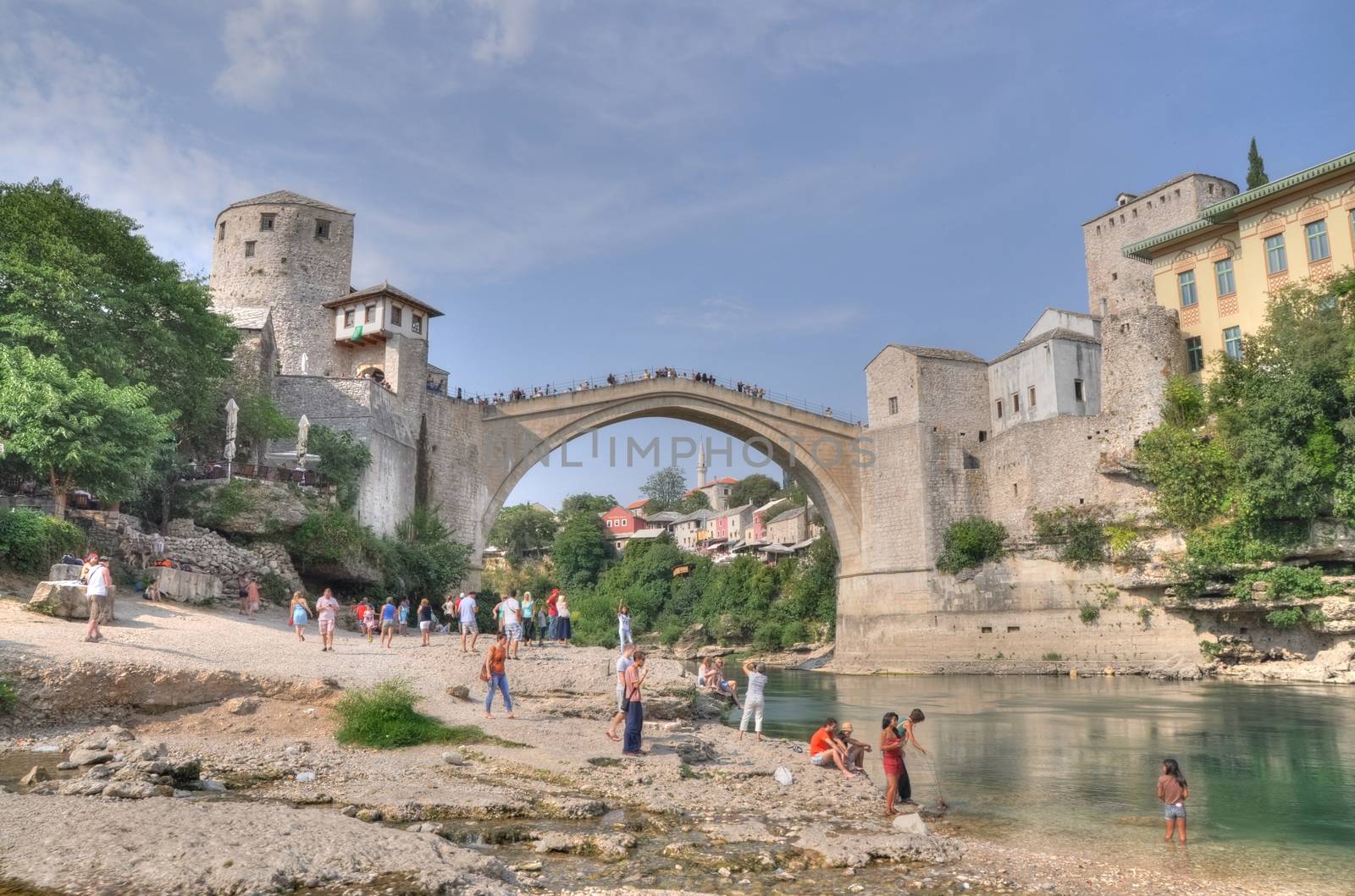 MOSTAR, BOSNIA-HERCEGOVINA AUGUST 10: Tourist at the old bridge  by anderm