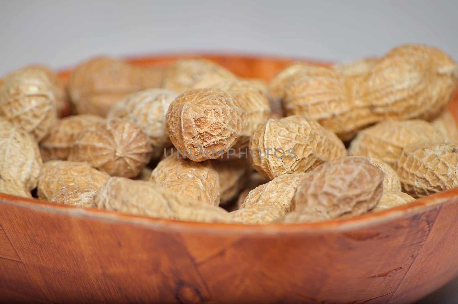 Peanuts in a brown bowl