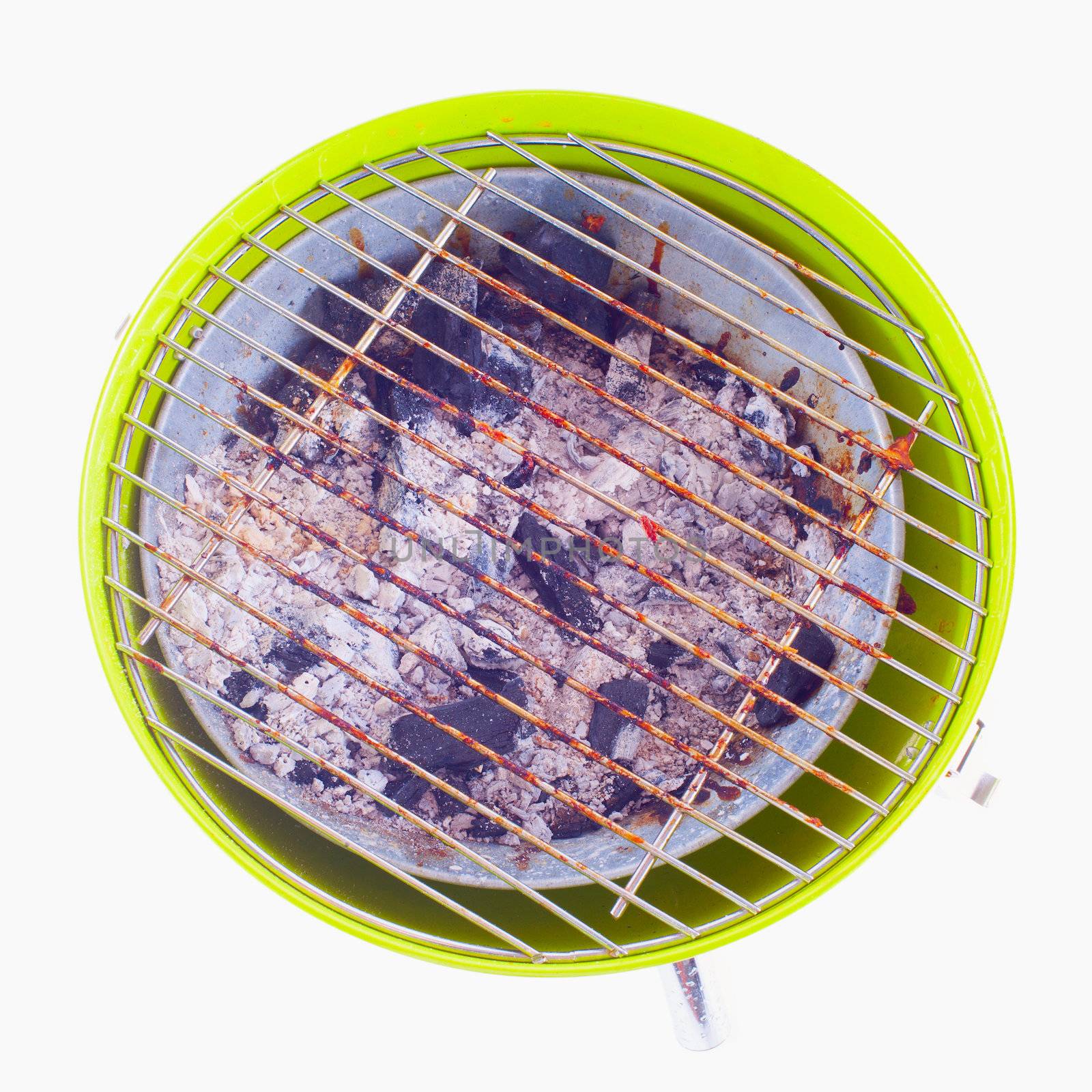 BBQ of green metal seen from above, isolated over white