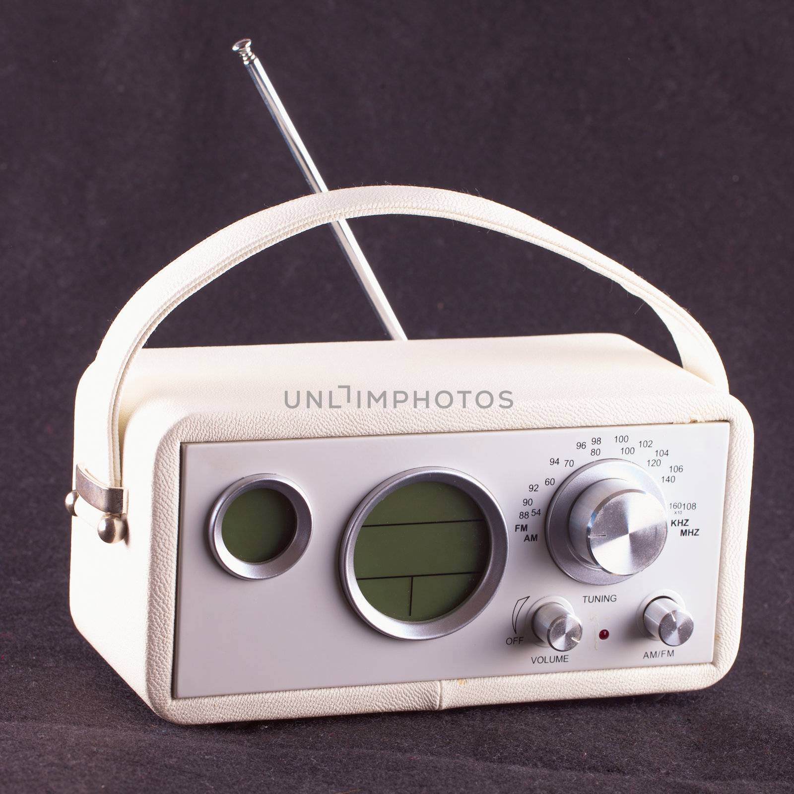 White vintage radio over black tissue background