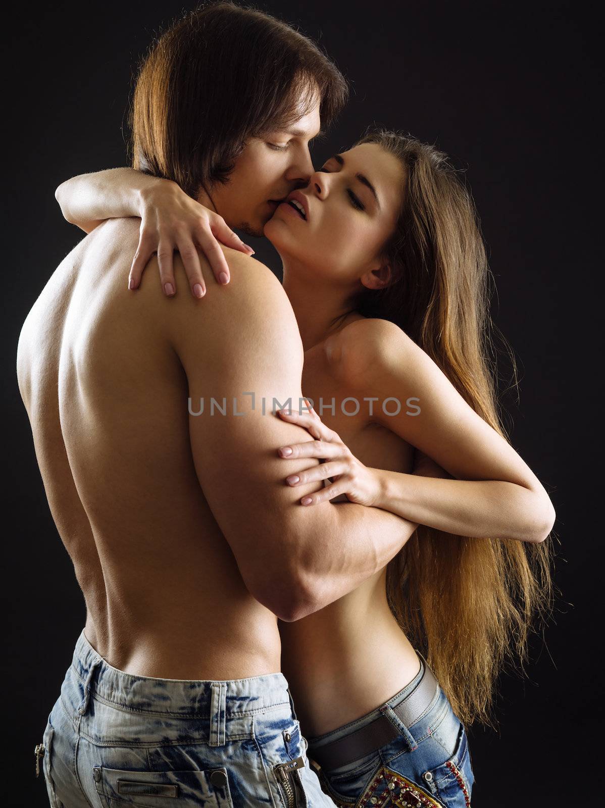 Beautiful young couple embracing by sumners