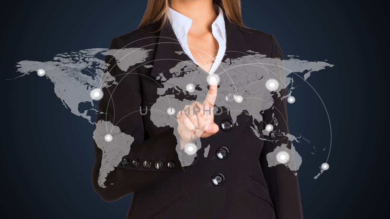 Businesswoman in a suit presses the virtual world map by cherezoff