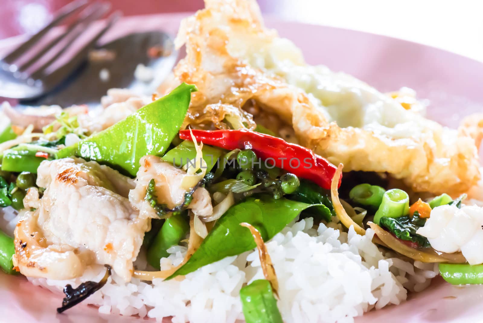 thai cuisine, basil fried rice and fried egg. by wmitrmatr