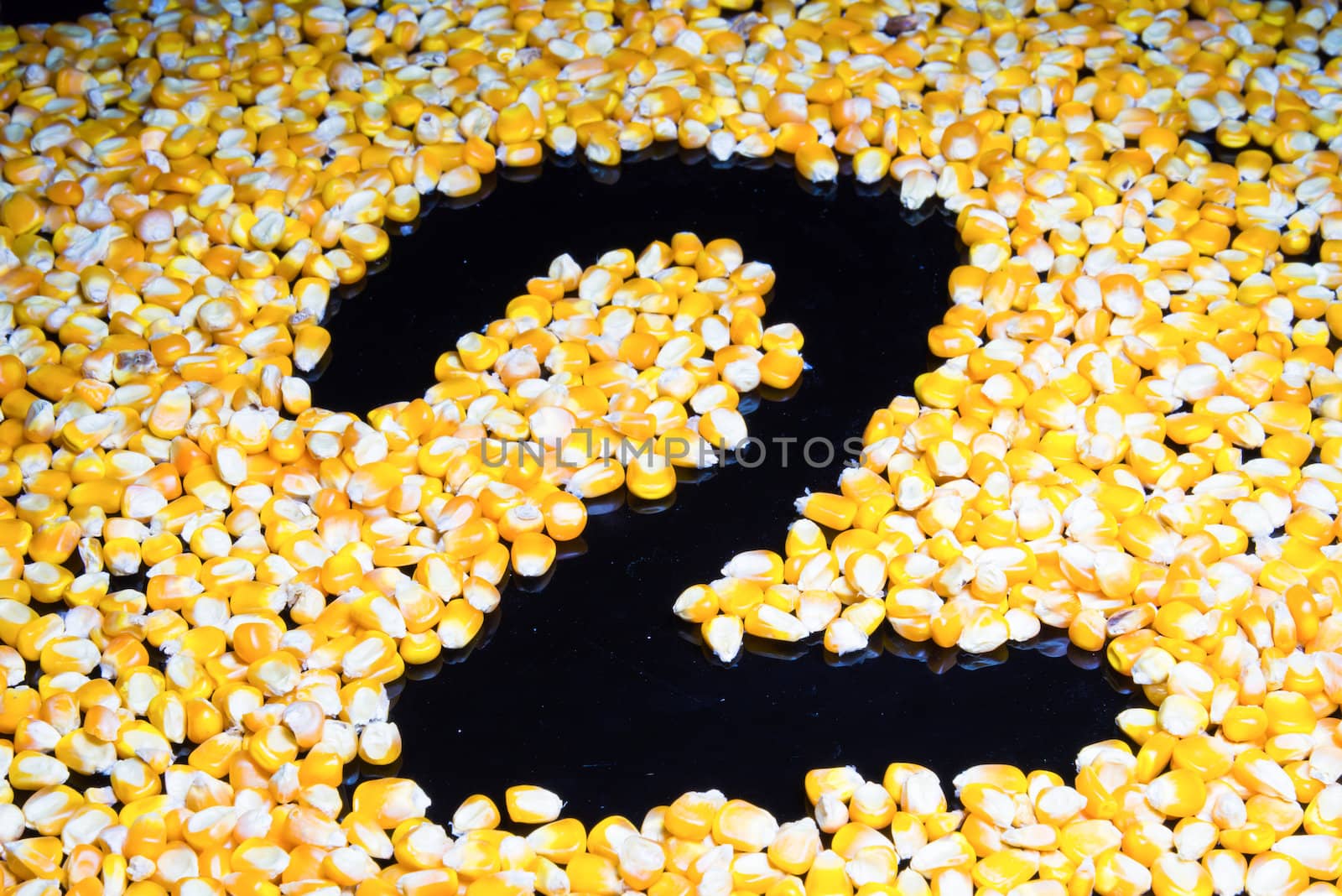 Corn made ​​the number two on a black background.