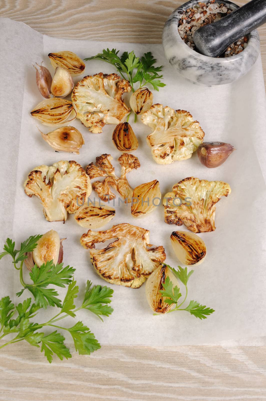 Warm appetizer of fried pieces of cauliflower with garlic and onion