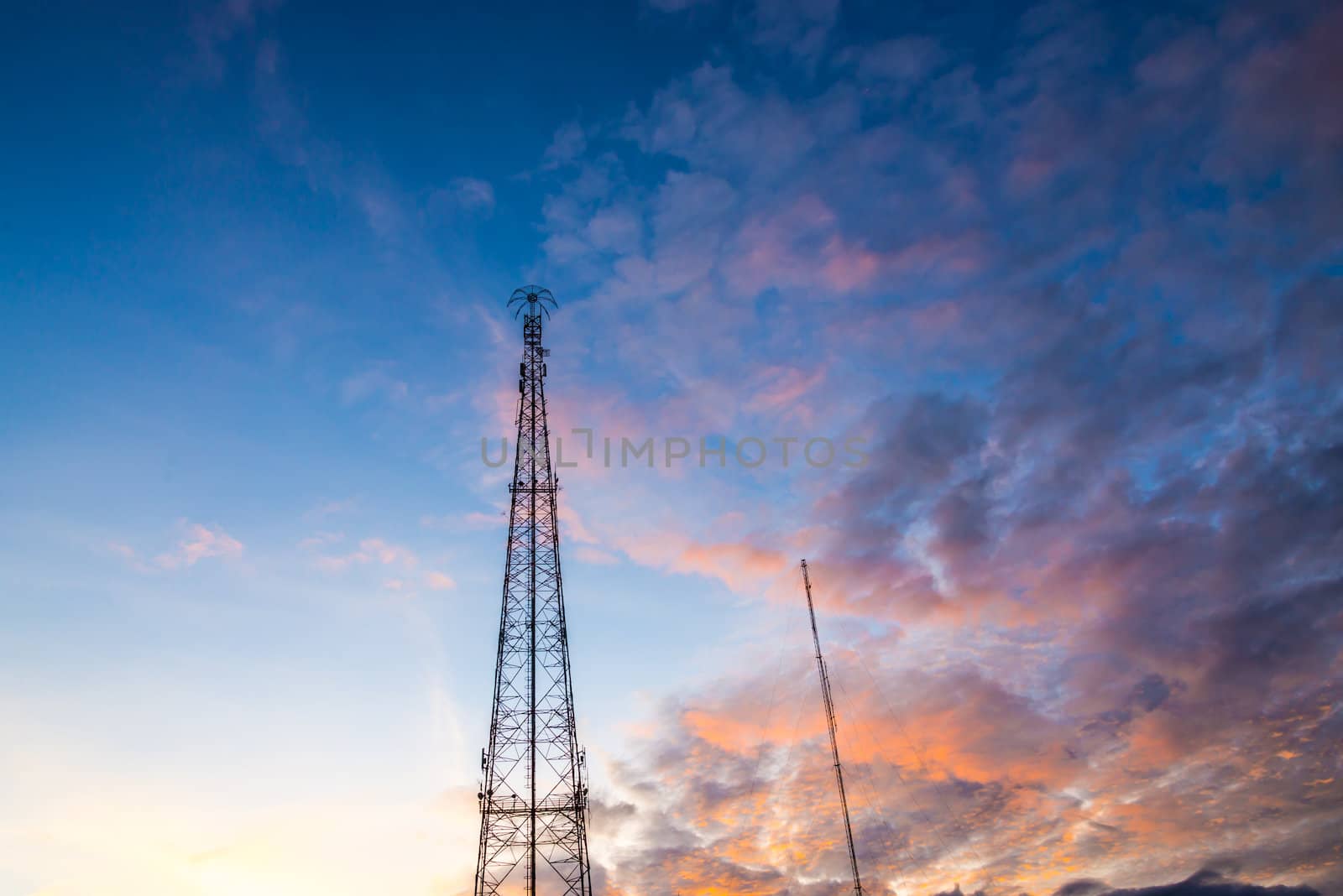 Silhouette of Mobile Telephone Antenna on sunset.