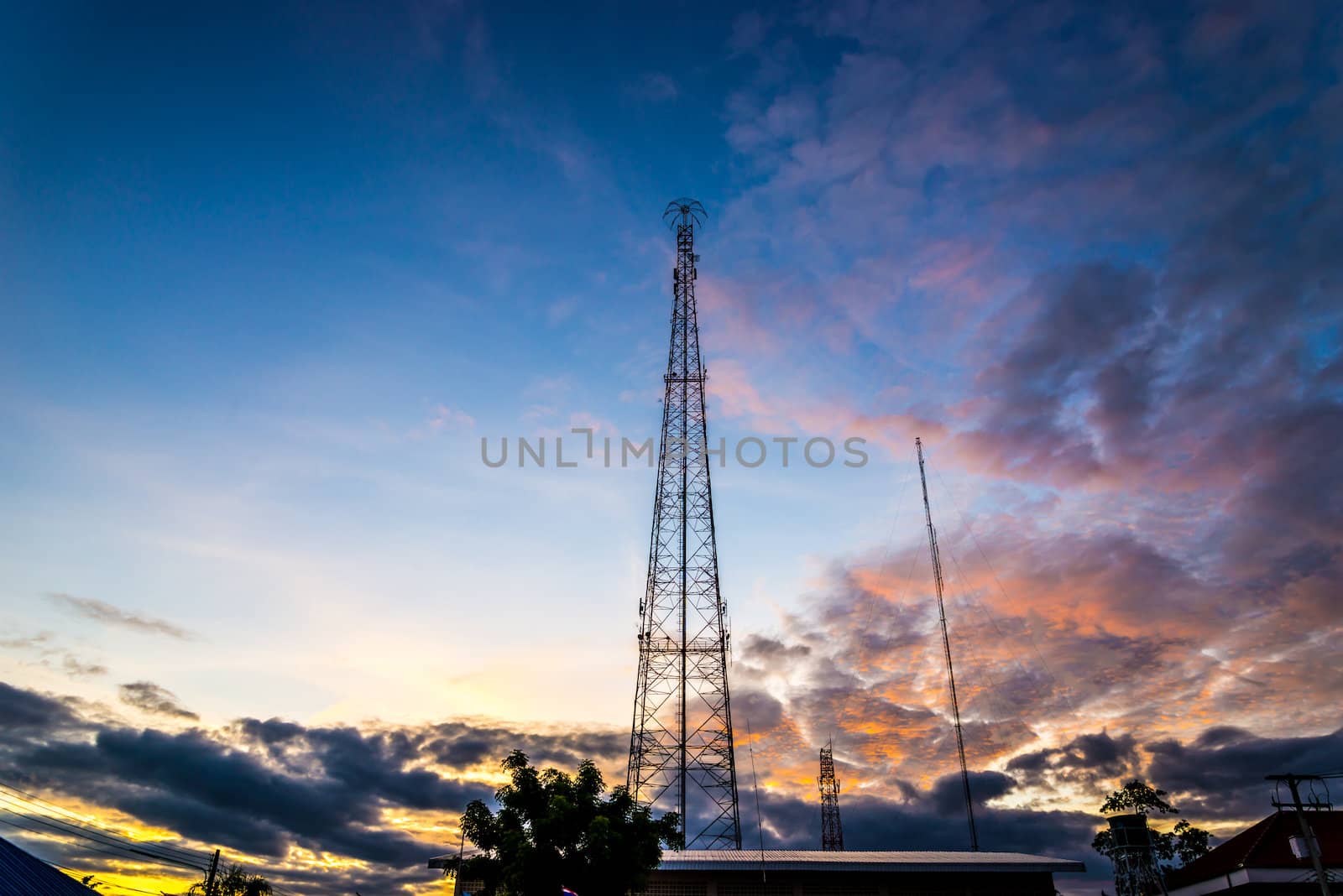 Silhouette of Mobile Telephone Antenna on sunset.