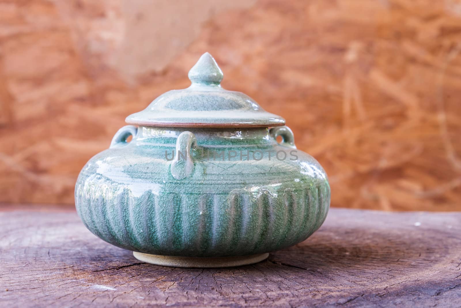 vintage ceramic pot on wood by wmitrmatr