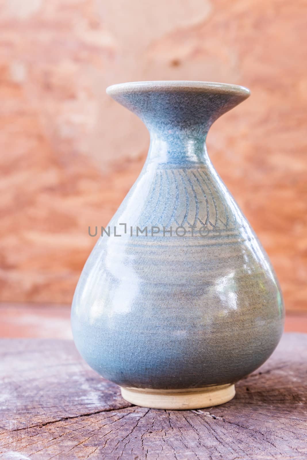 vintage ceramic vase on wood by wmitrmatr