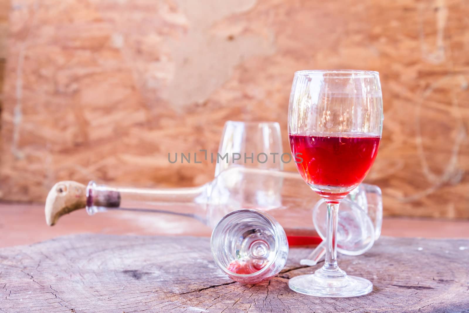 red wine on wooden background still life image