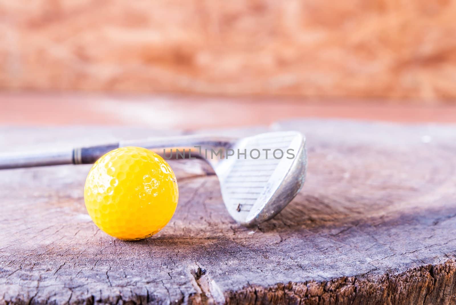 Still life Yellow Miniature Golf Ball On White Background. by wmitrmatr