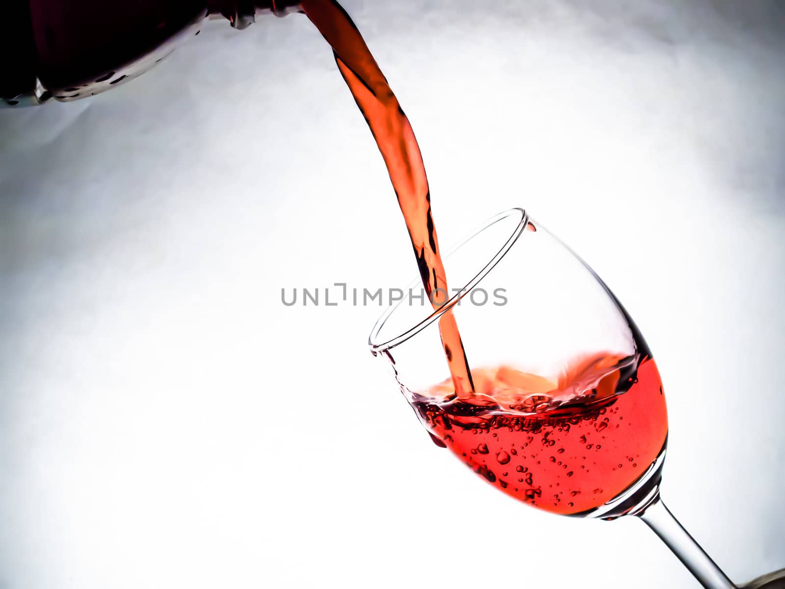 Red wine being poured into wine glass