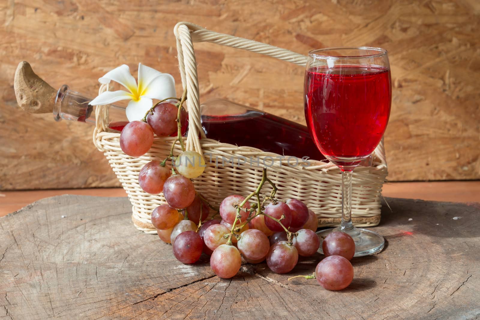 Wine and grapes on old wood.