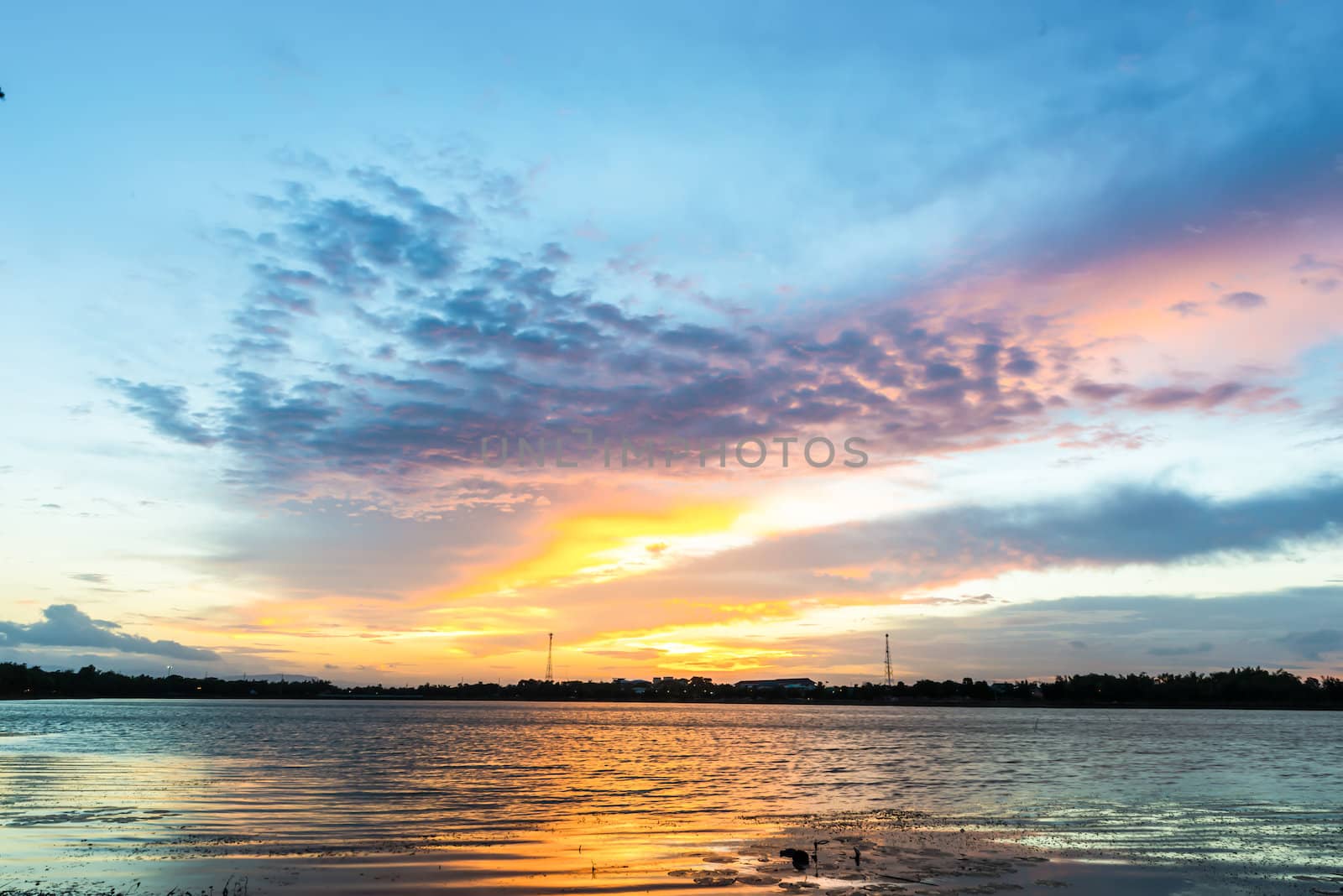 sunset over lake in thailand.