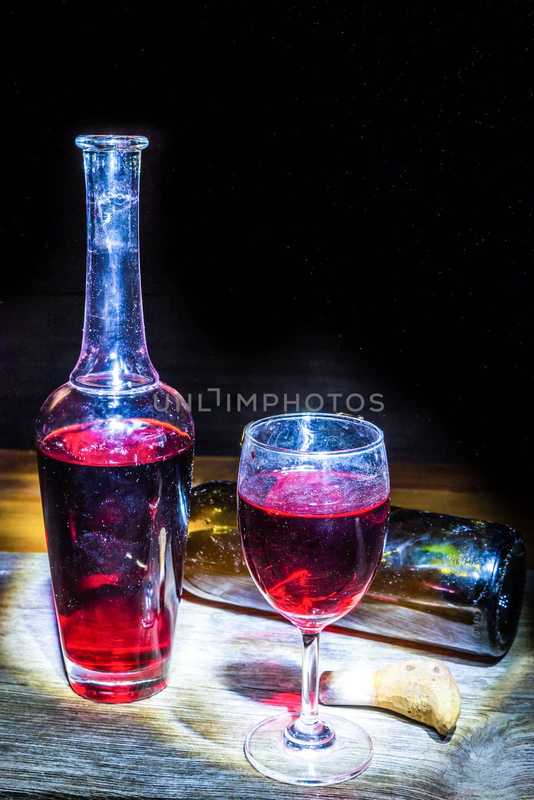 still life Wine glass and Bottle on a wooden background
