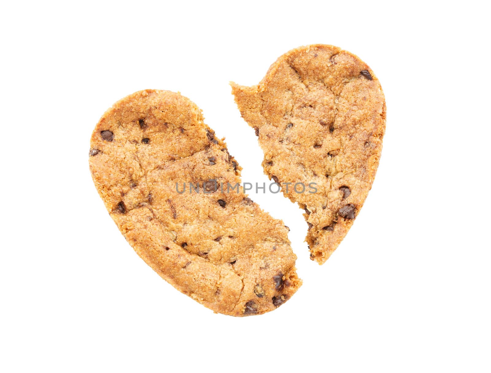 Cracked heart shaped chocolate chip cookie isolated  by vitawin