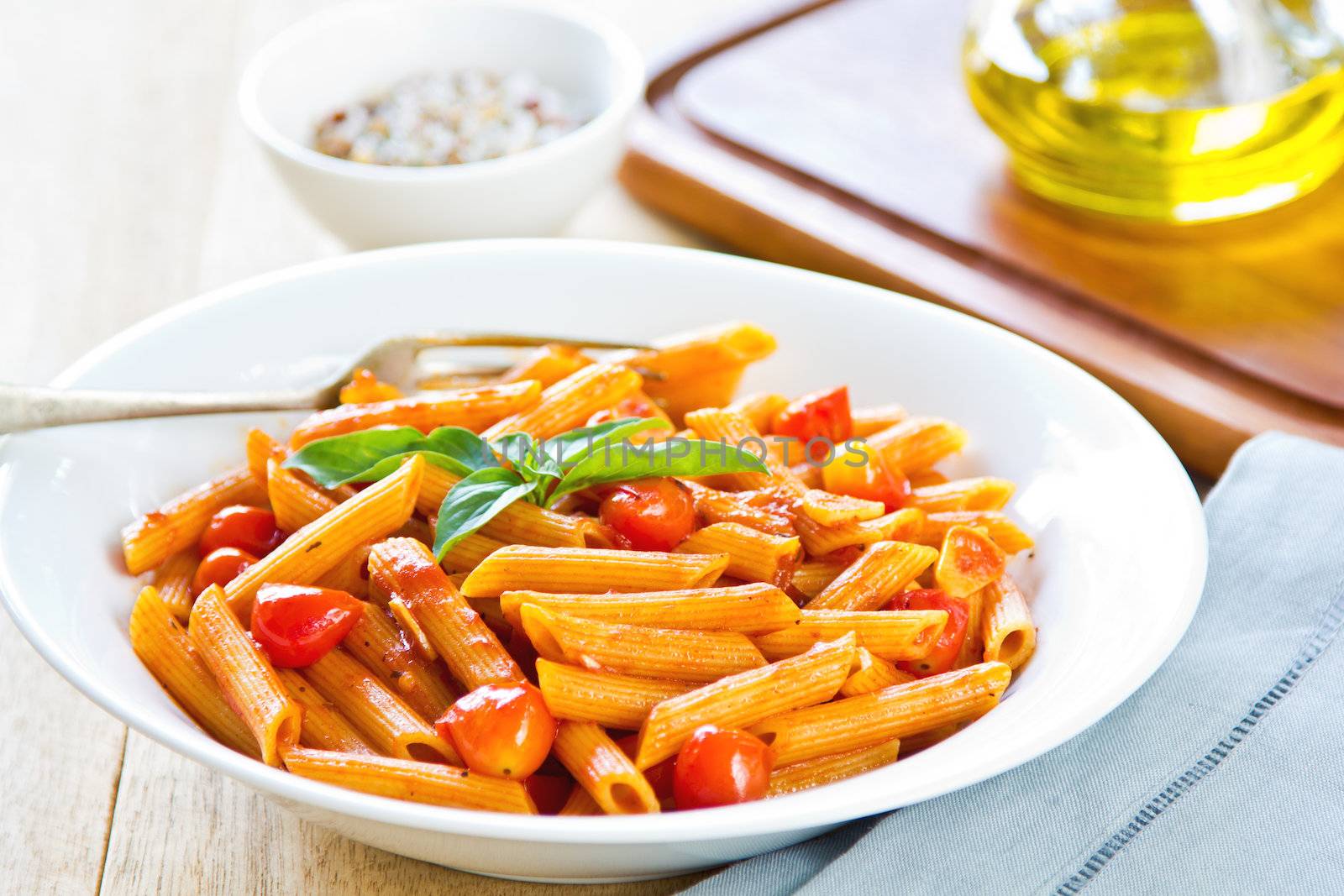 Penne in tomto sauce with basil  on top