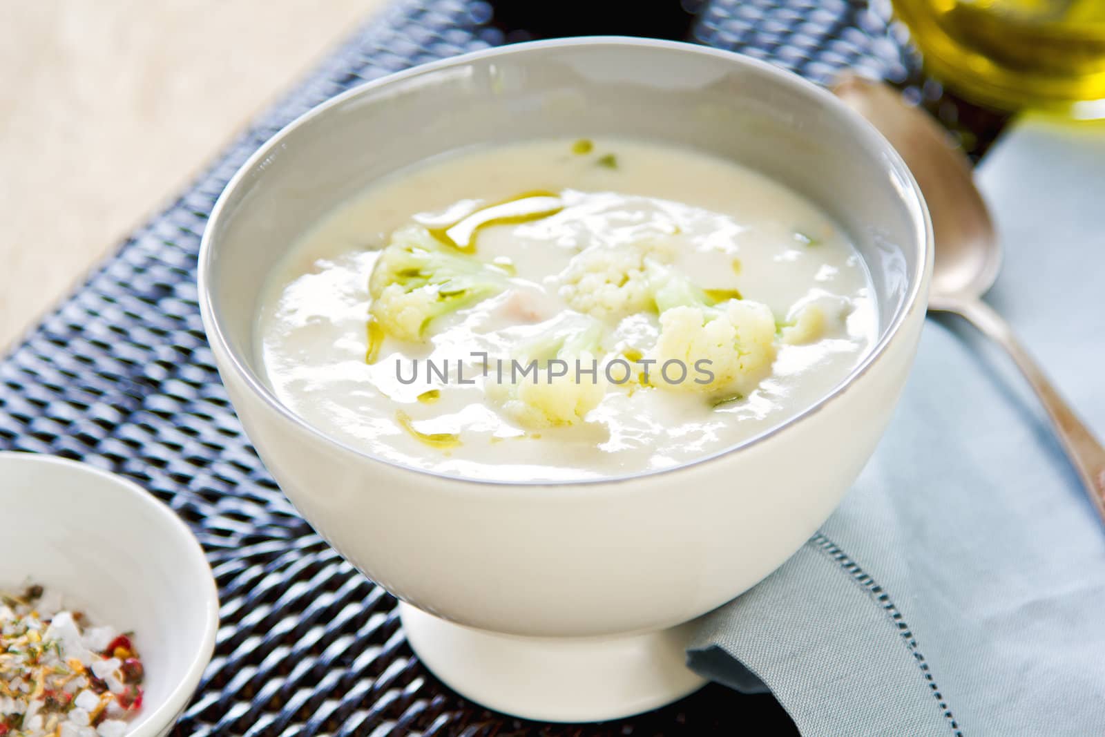 Cauliflower soup with some Cauliflower in a bowl