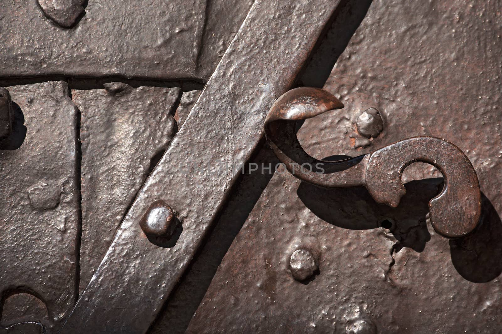 Close up of ancient door in wrought iron - Monte Lussari, Italy 