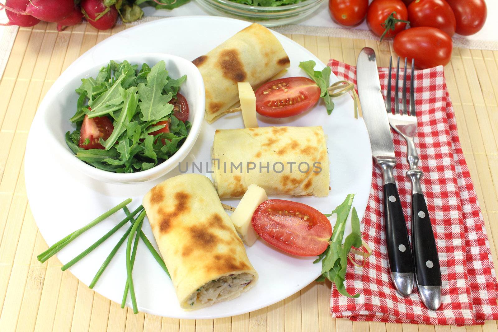 a crepe stuffed with cheese, radishes and chives