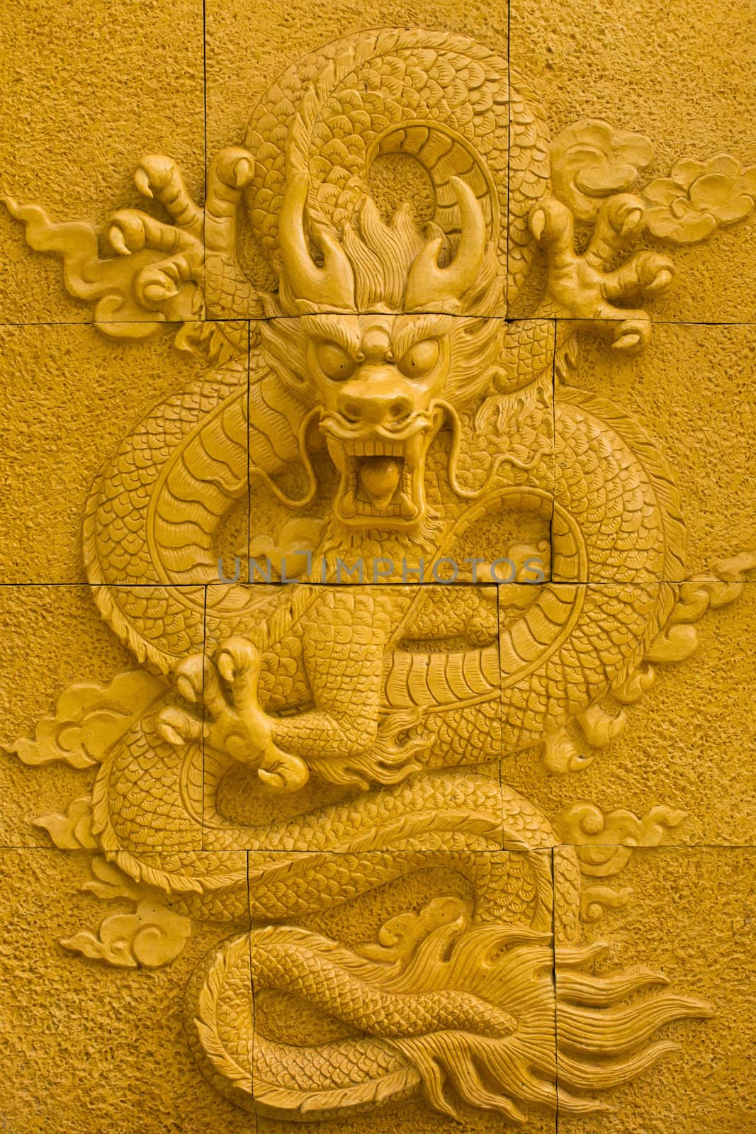 Dragon sculpture on the wall by Thanamat