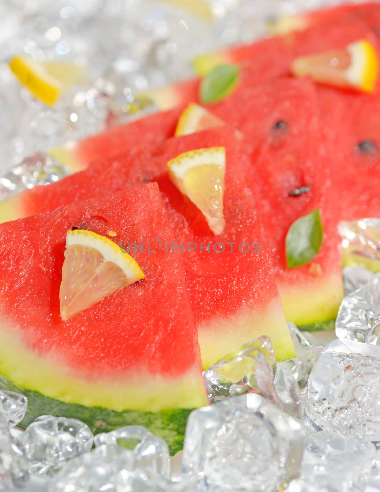 slices of red watermelon and ice cubes