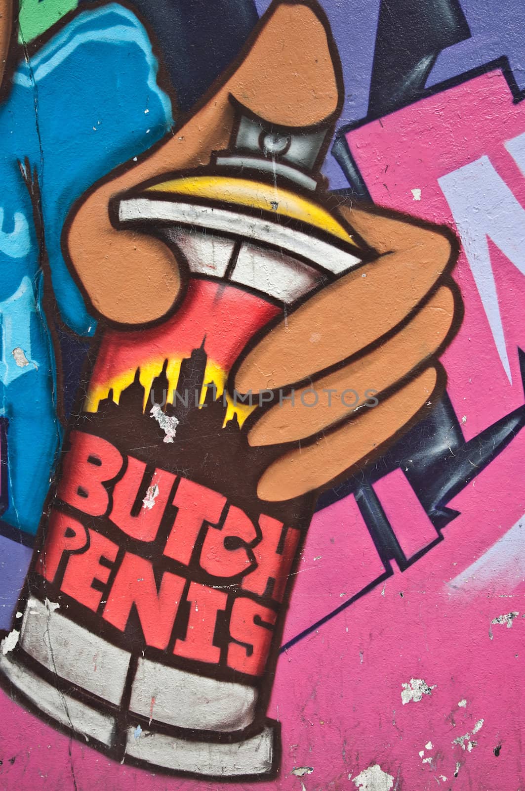urban Art street in paris - hand with paint bomb