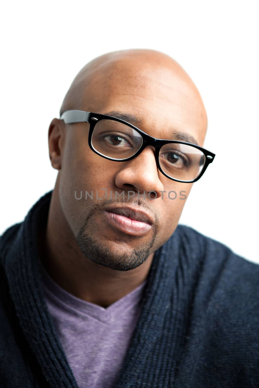 Stylish African American man wearing black framed glasses. Shallow depth of field.