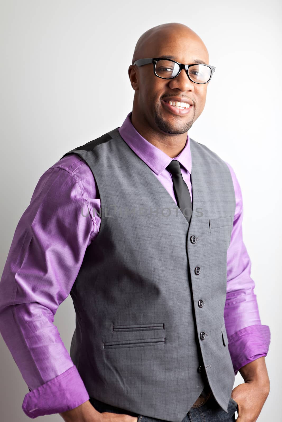 Stylish modern business man wearing black framed glasses.