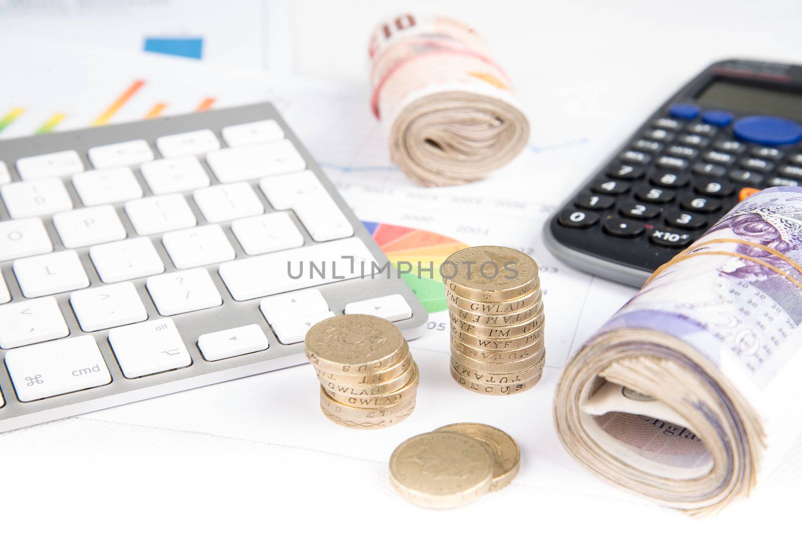 British pound sterling coins and bank notes on desk