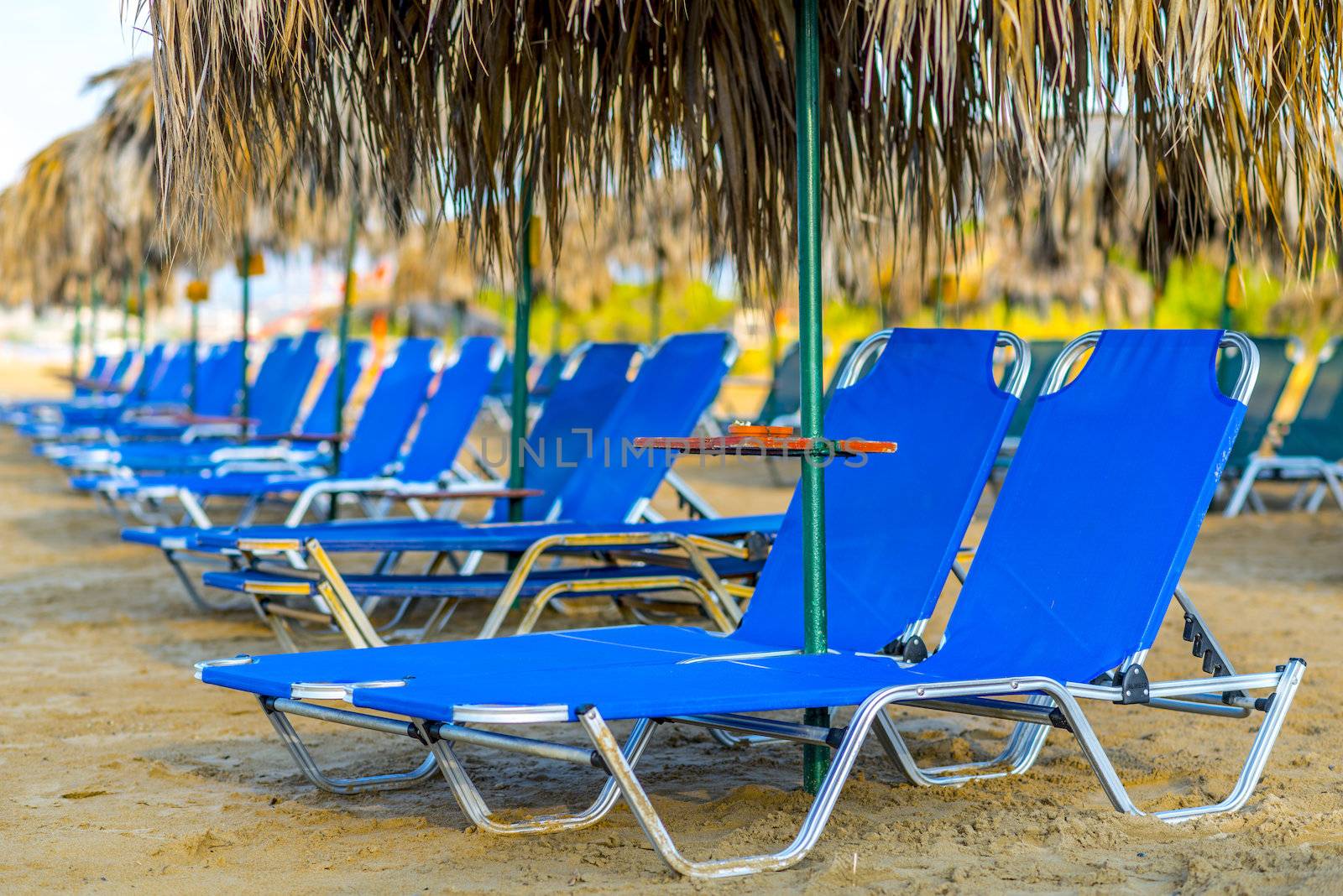 Beach Sunbeds With Straw Umbrellas by Rainman