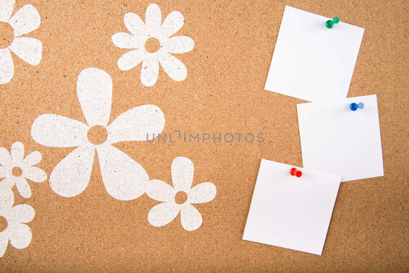 Color sticky memo note cards on cork board