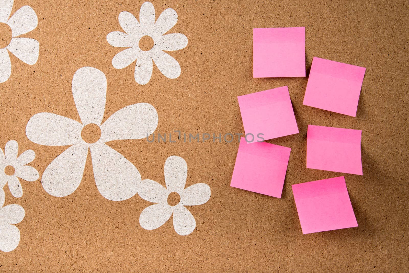 Color sticky memo note cards on cork board