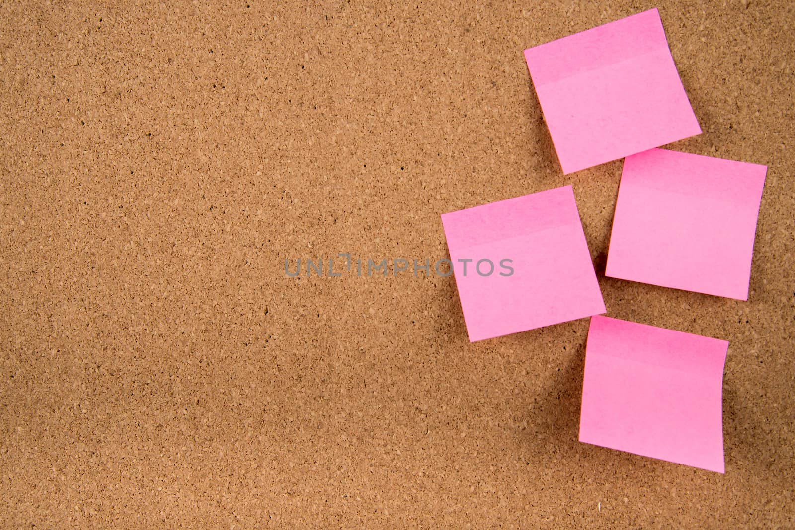 Color sticky memo note cards on cork board