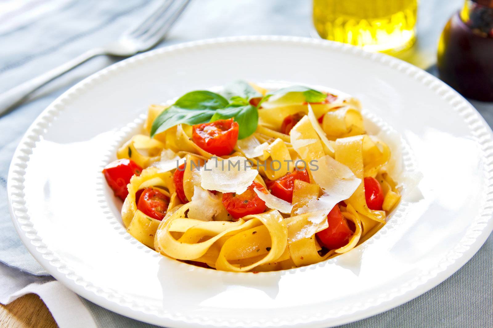 Tagliatelle with cherry tomato and Parmesan on top