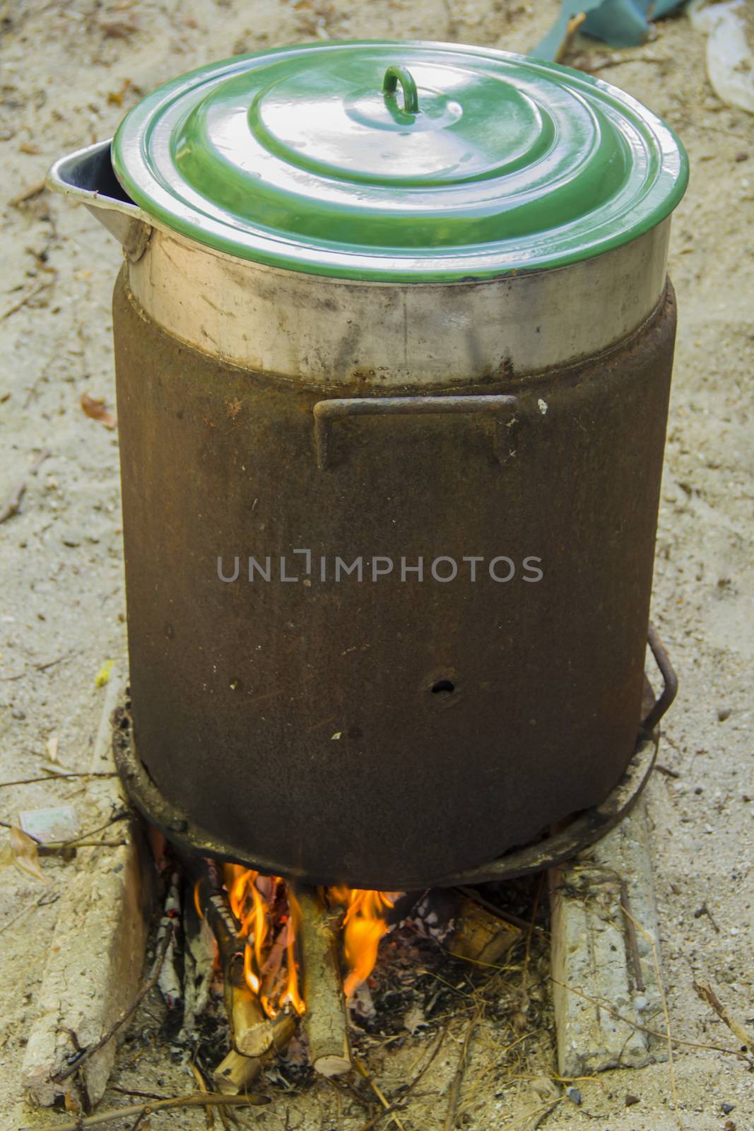 big brown pan on the big fire