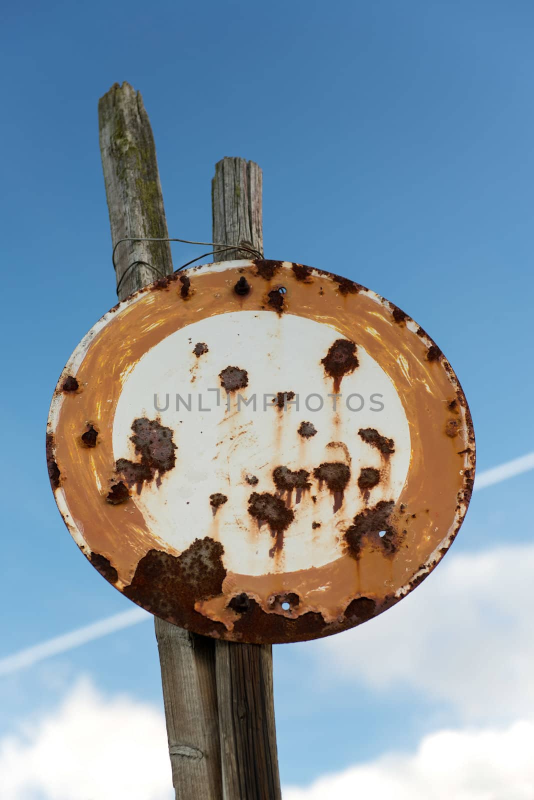 Rusty Old No Vehicles Traffic Sign Against The Blue Sky