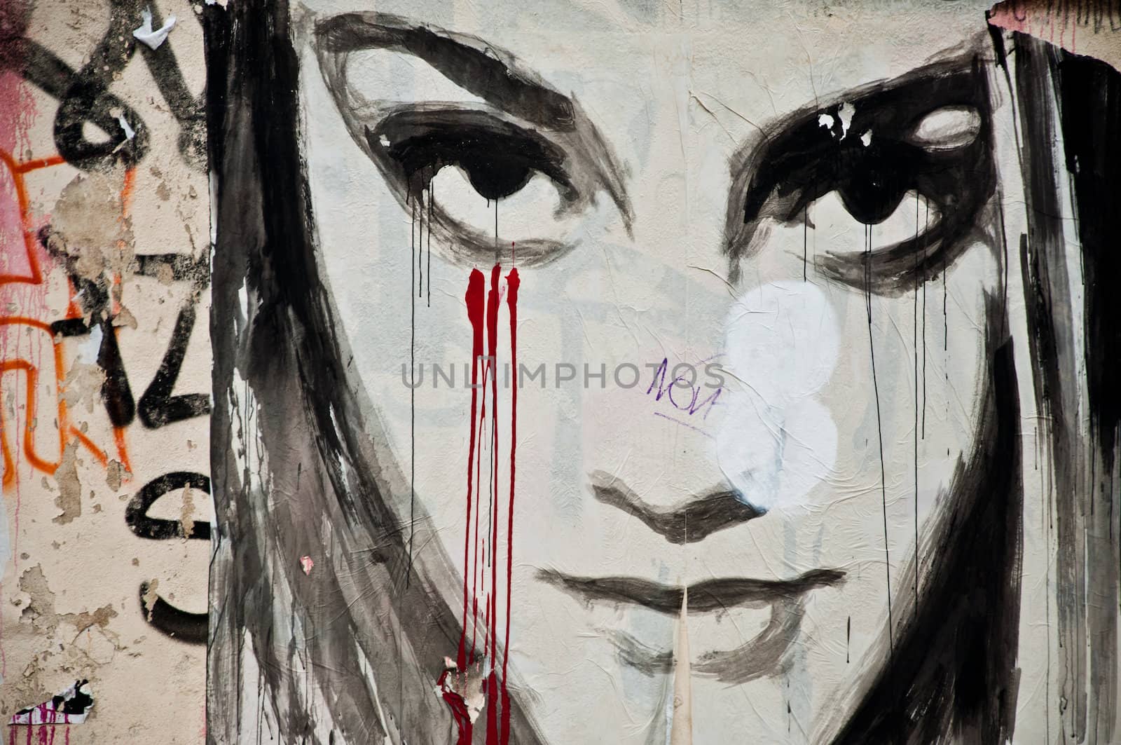 urban art  street in Paris- woman face with blood