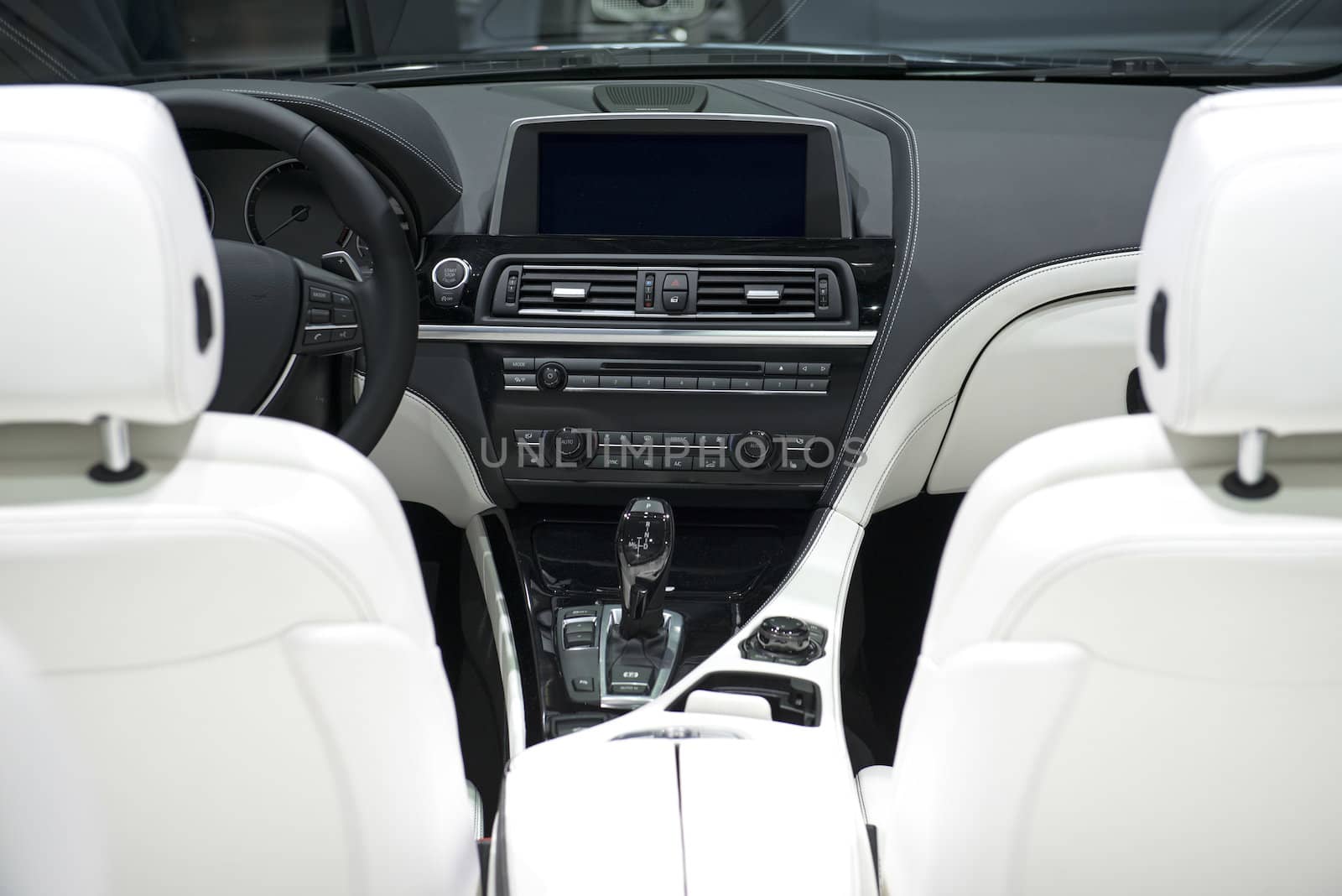 Modern Car Dashboard With White Leather Frontal Seats