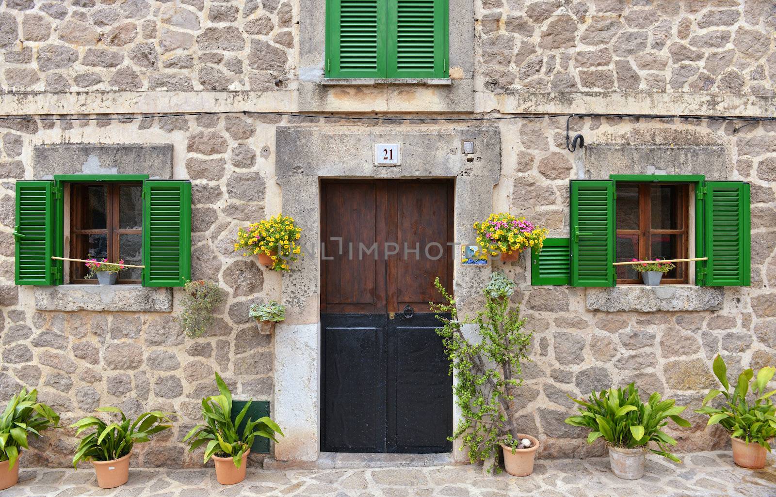 Typical Mediterranean Village with Flower Pots in Facades in Val by Rainman