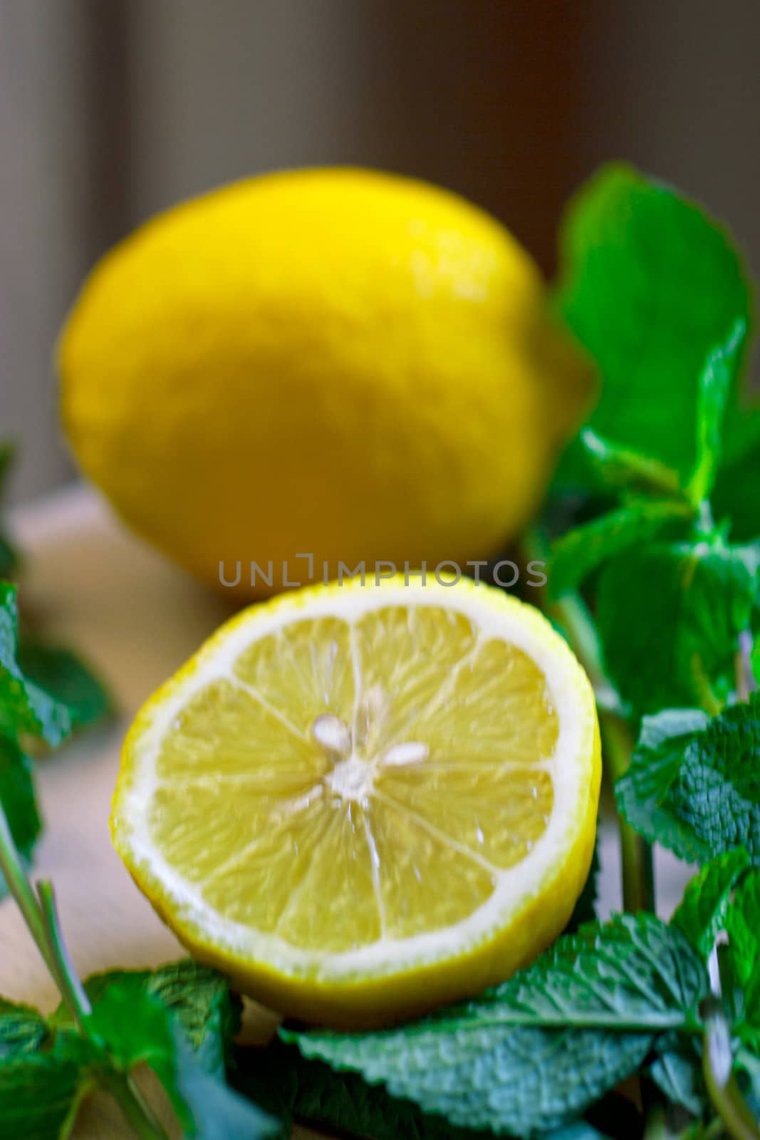 Cut the lemon and mint are on the board