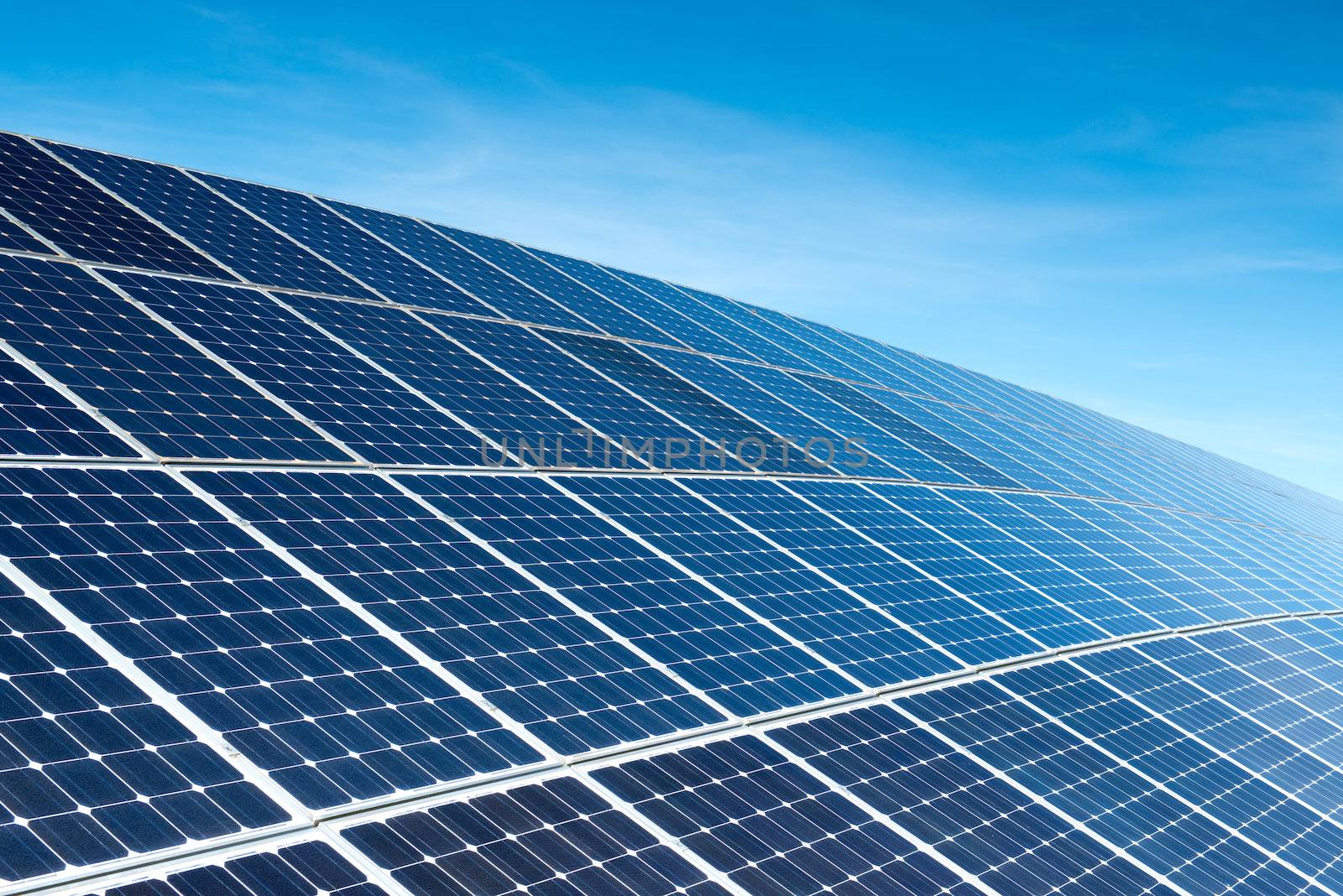 Solar Panels Against The Deep Blue Sky