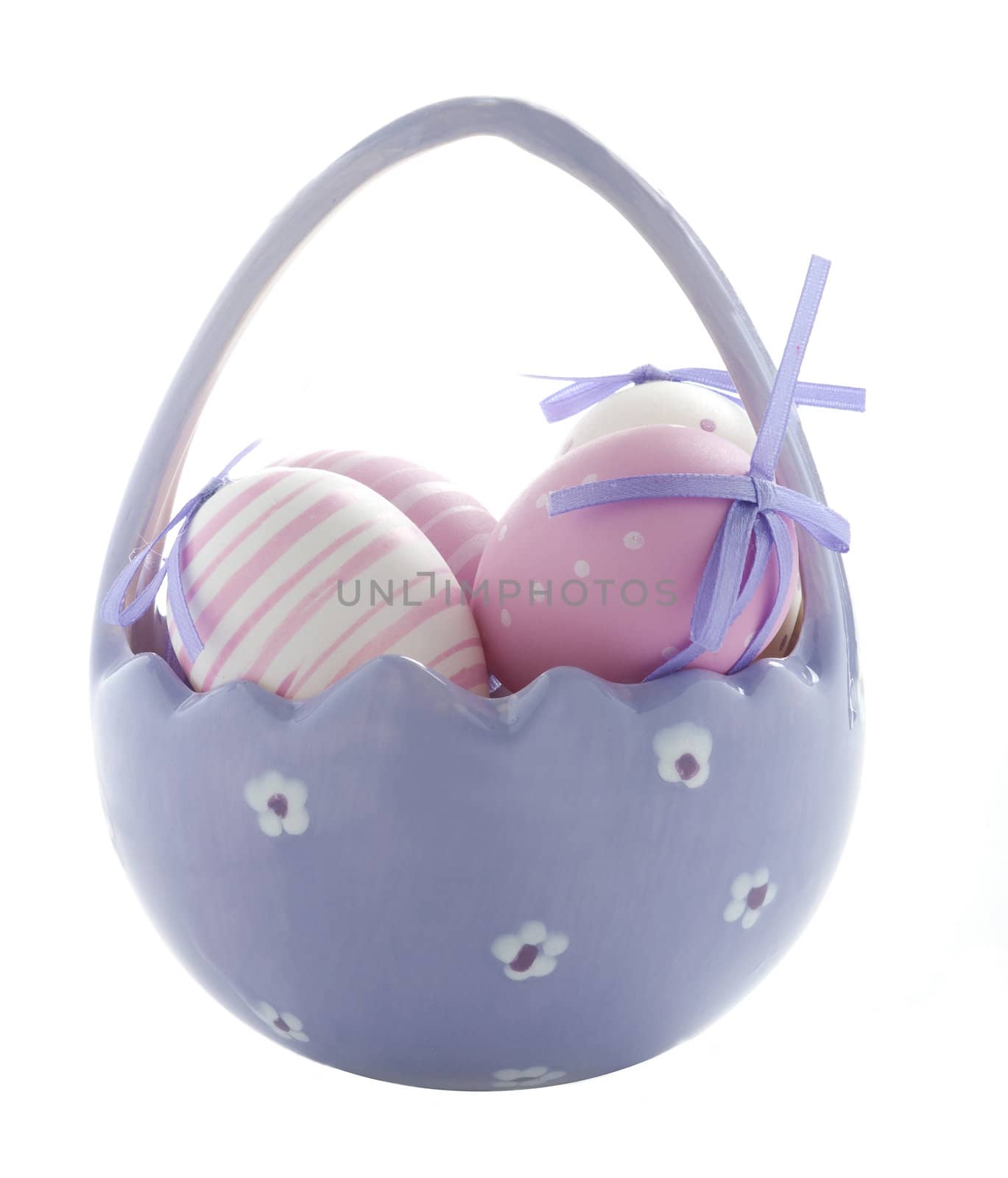 Purple Easter Eggs in a China Basket Isolated On White
