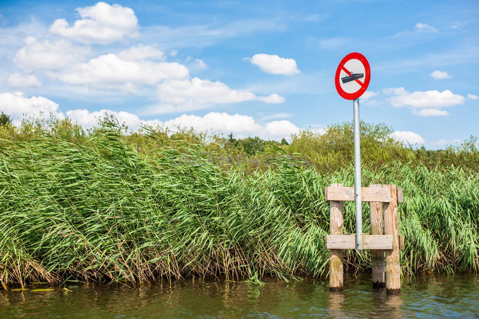 Lake scenery with a red no boating sign