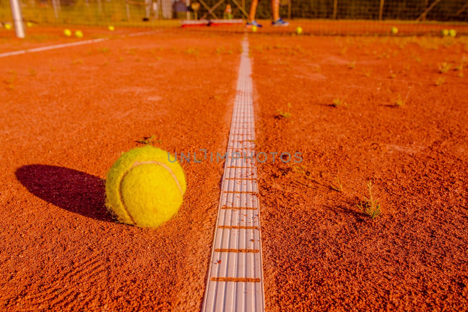 Tennis training session with a ball at the line