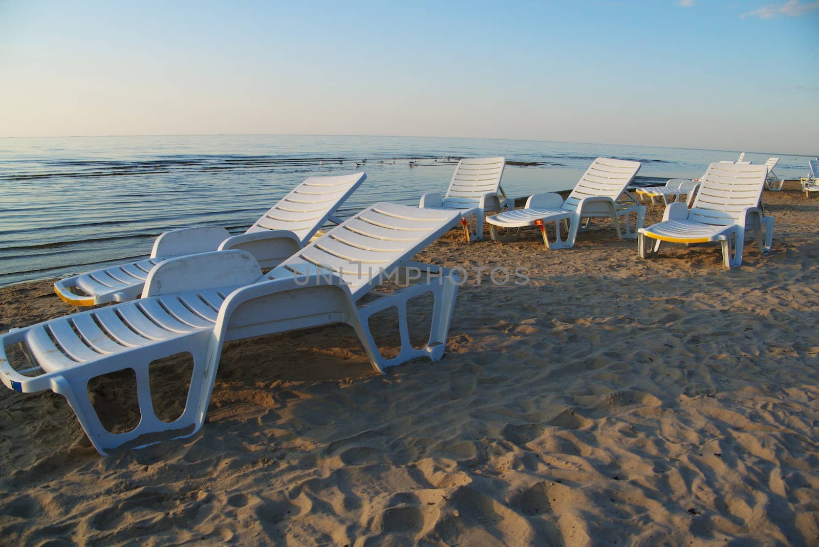 Chaise longue on the Baltic beach in evening