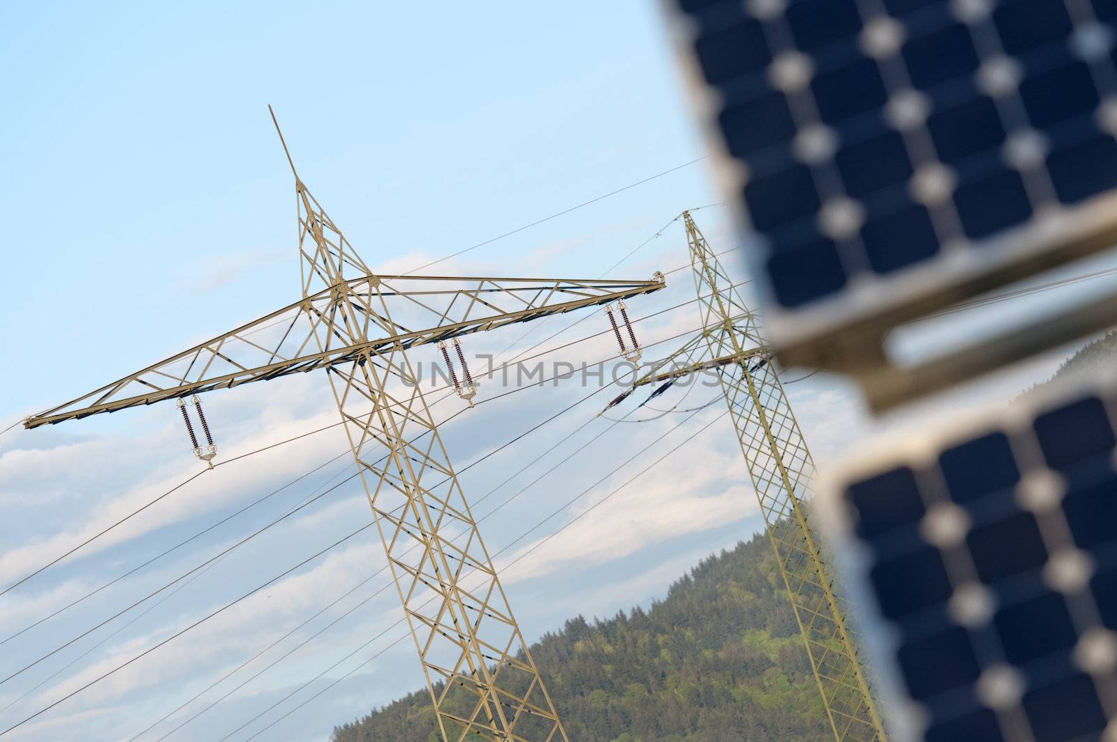 Solar Panel With High Voltage Tower in Background