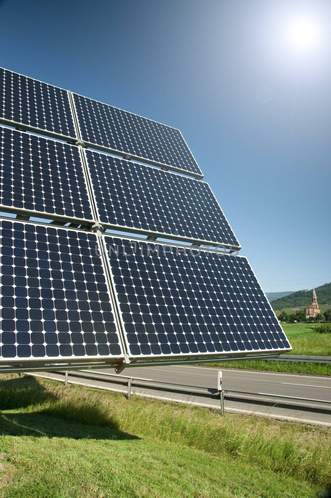 Solar Panel With The Sun Against The Blue Sky