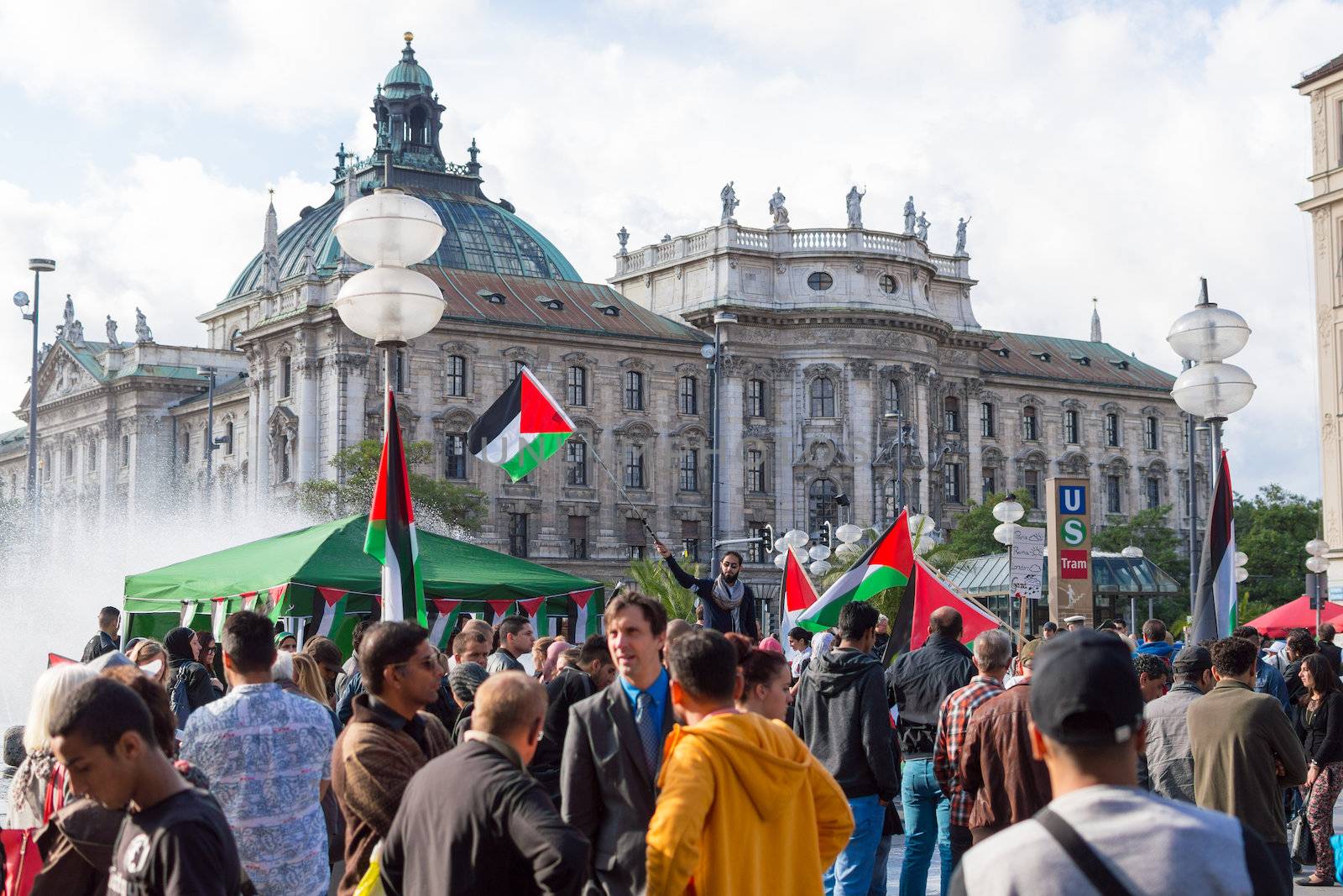 MUNICH, GERMANY - AUGUST 16, 2014: Pro-Palestinian demonstration in the central square of European city. Demonstrators are asking the German government for assistance in ending the Arab-Israeli conflict, and end the war in Gaza.
